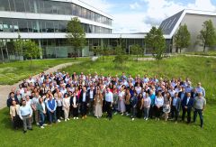 A group picture of the whole CODICO team infront of the office and warehouse building.