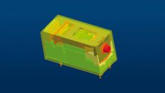 Ein Elektromechanisches Relay auf einem blauen Hintergrund.