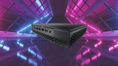 Ein Mini PC auf violettem Hintergrund.